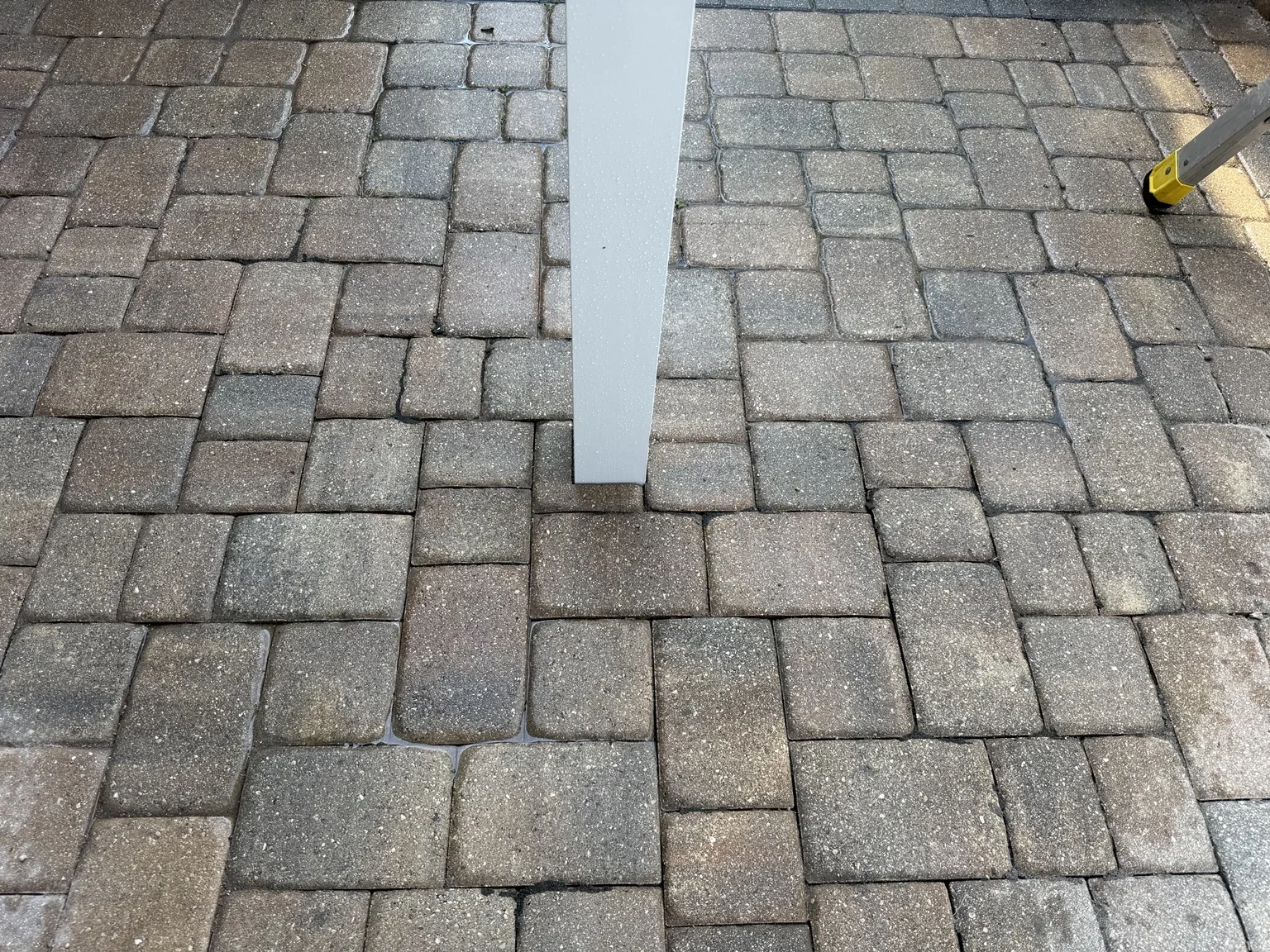 Careful post placement integrated into the existing paver patio.