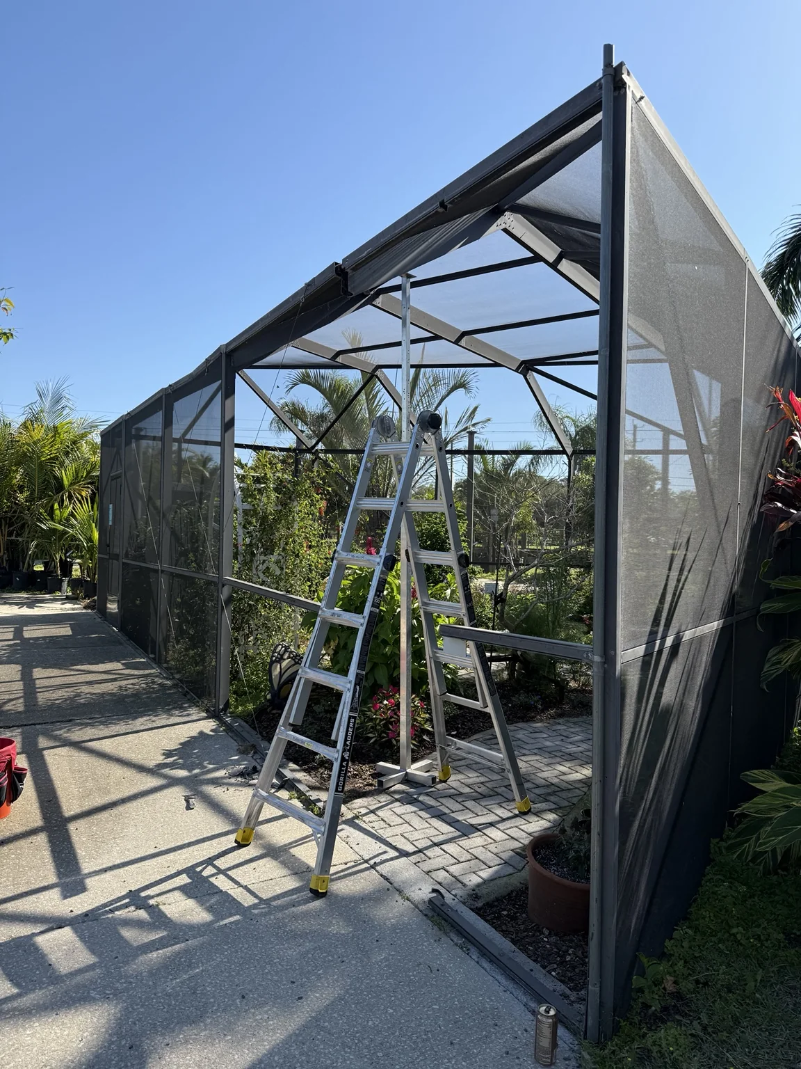 Repairing and rescreening the butterfly sanctuary enclosure while preserving the existing structure.
