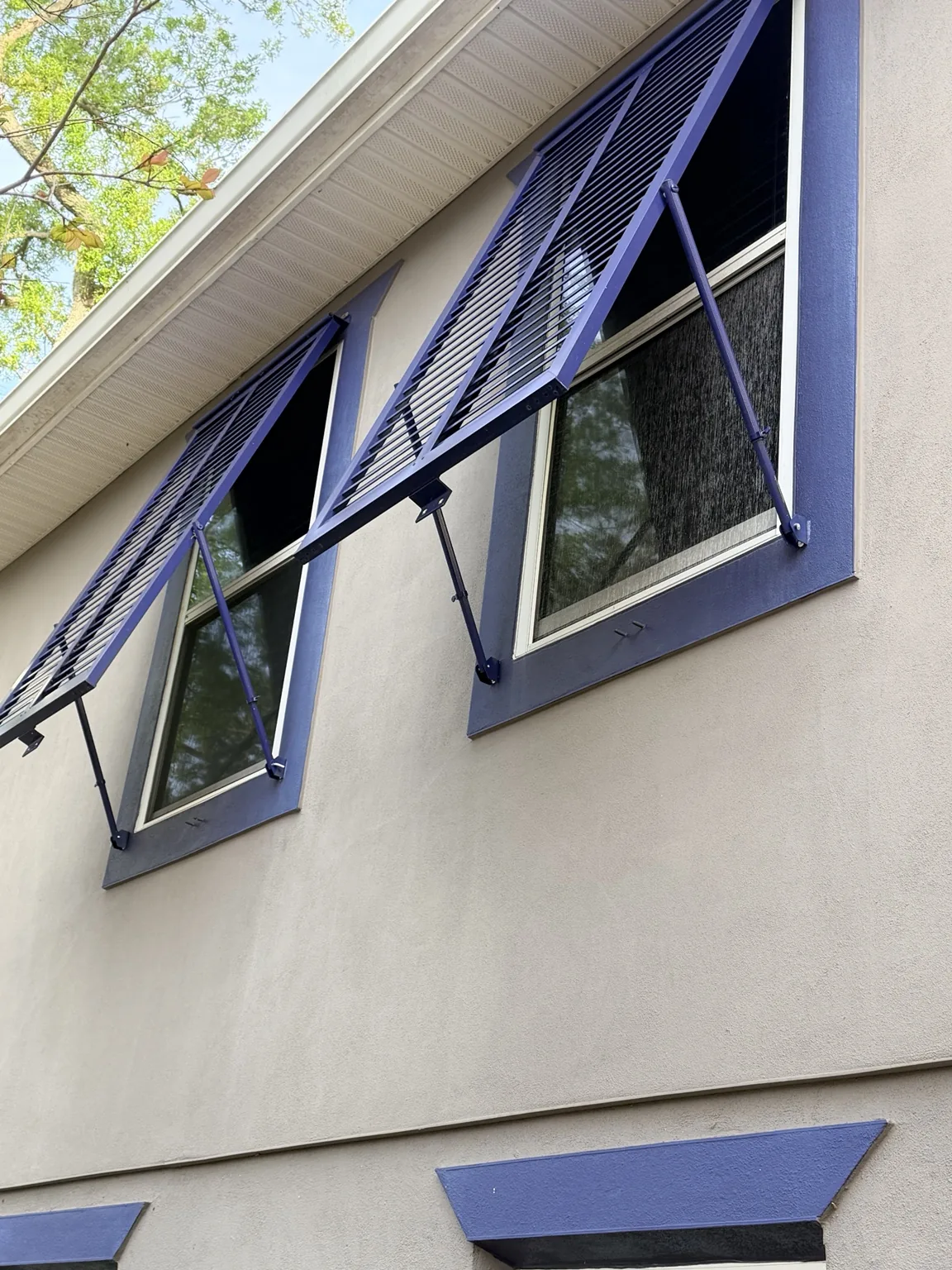 Close-up of the adjustable supports and aluminum louvered shutter construction.