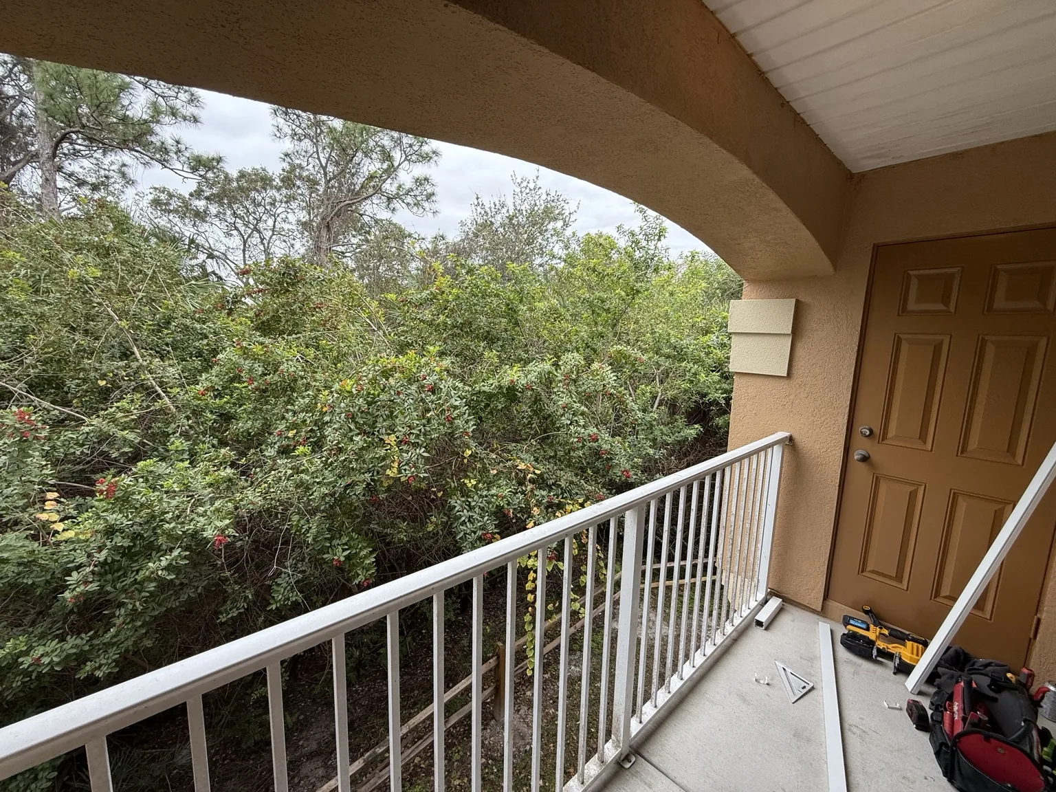 Open balcony before custom screening was installed.