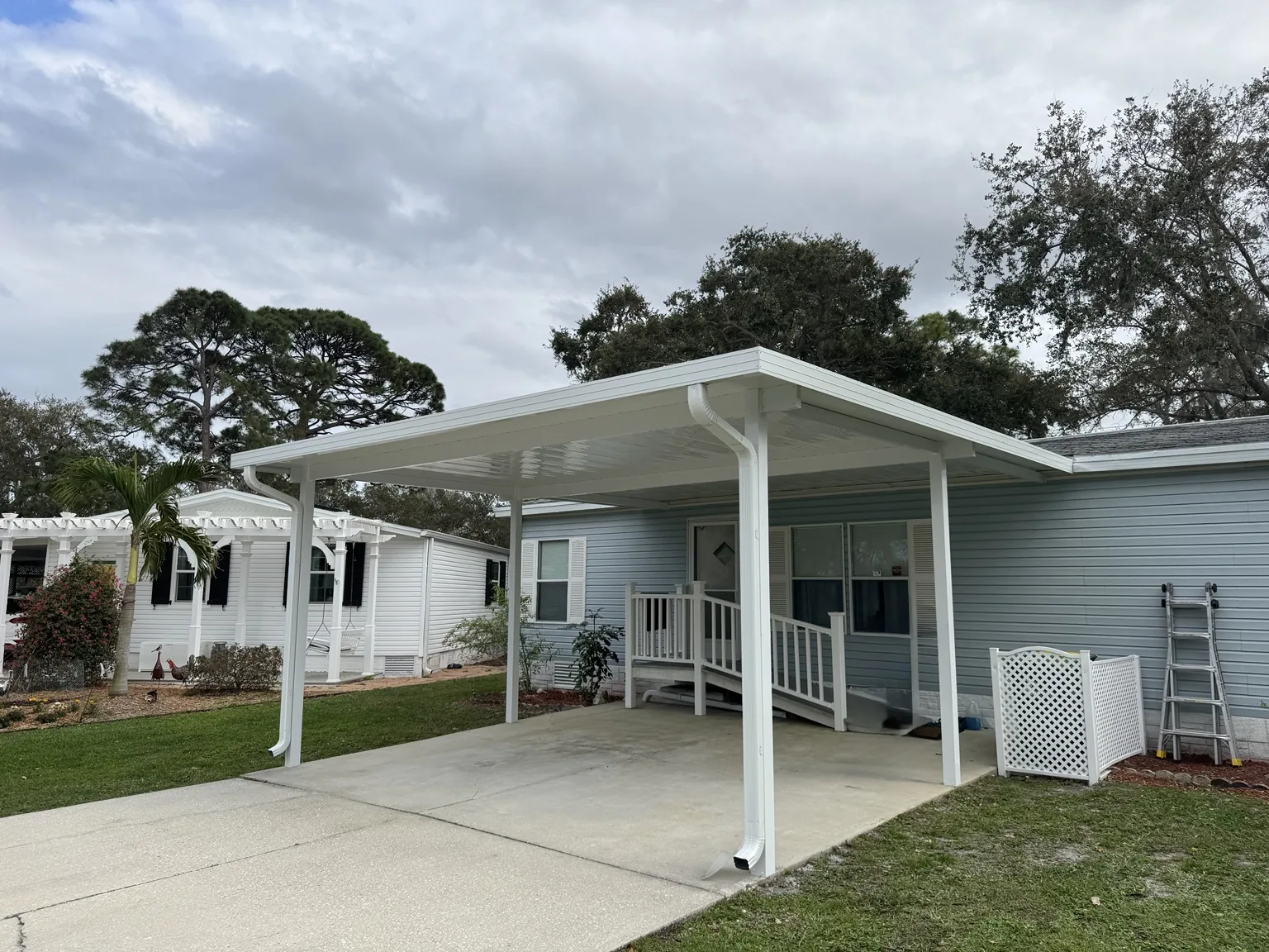 Custom attached carport providing covered parking and a clean transition to the home.