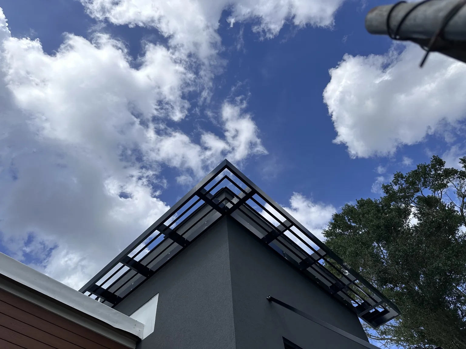 Custom open-frame architectural awning fabricated for a specialty exterior application.